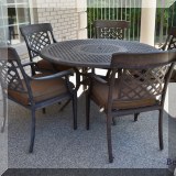 L02. Round metal patio table with 5 chairs. 39”h x 53”w 